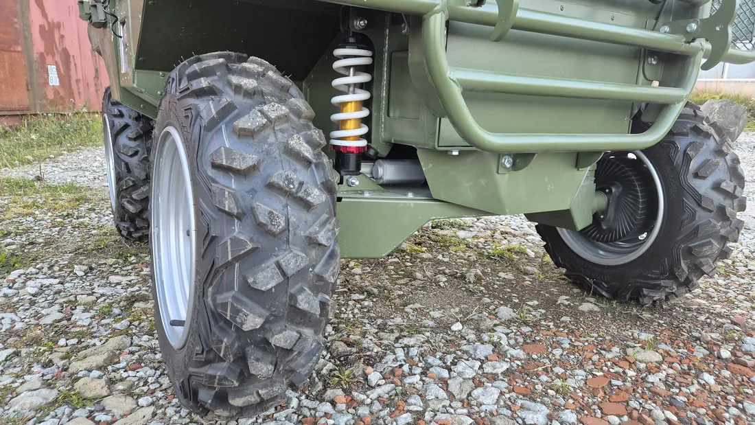 Close view of the front suspension, coil-over damper and hub drive.